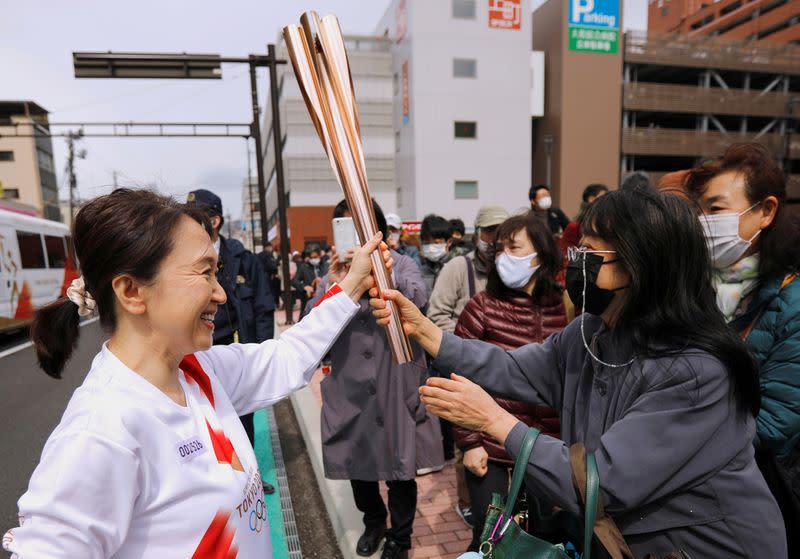 FILE PHOTO: Second day of the Tokyo 2020 Olympic torch relay in Fukushima prefecture, Japan