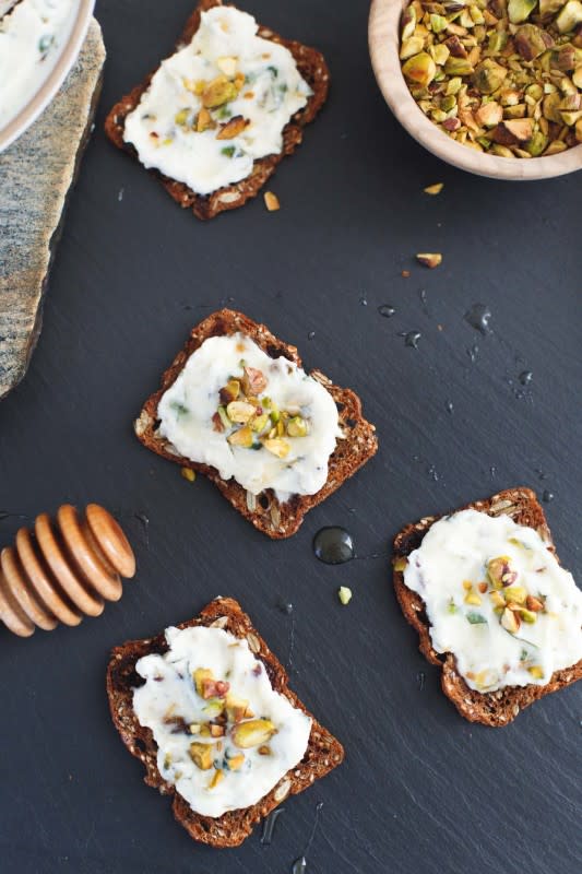 <p>Snixy Kitchen</p><p>Do you love pistachio? This flavorful cheese spread will go wonderfully with crackers, or even homemade bread. </p><p><strong>Get the recipe: <a href="https://www.snixykitchen.com/pistachio-basil-ricotta-spread-honey/" rel="nofollow noopener" target="_blank" data-ylk="slk:Pistachio Basil Ricotta Spread with Honey;elm:context_link;itc:0;sec:content-canvas" class="link ">Pistachio Basil Ricotta Spread with Honey</a></strong></p>