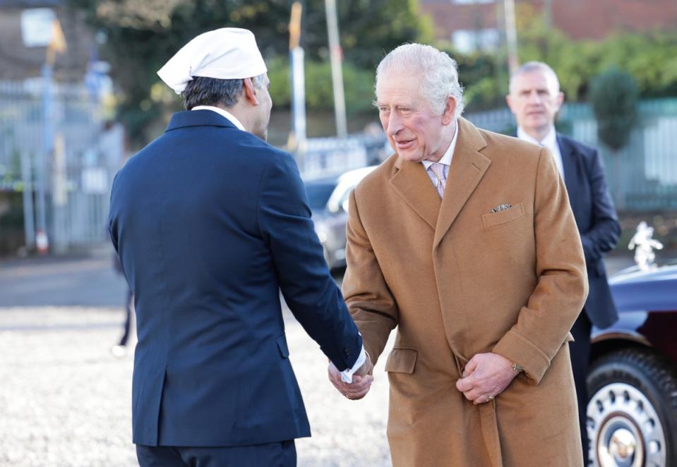 King Charles III Is greeted by Professor Gurch Randhawa, a member of the Sikh Congregation during a visit to the newly built Guru Nanak Gurdwara (Getty Images)