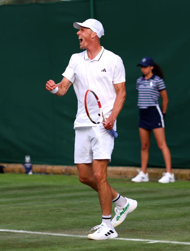 Jan Choinski celebrates his victory over Dusan Lajovic 