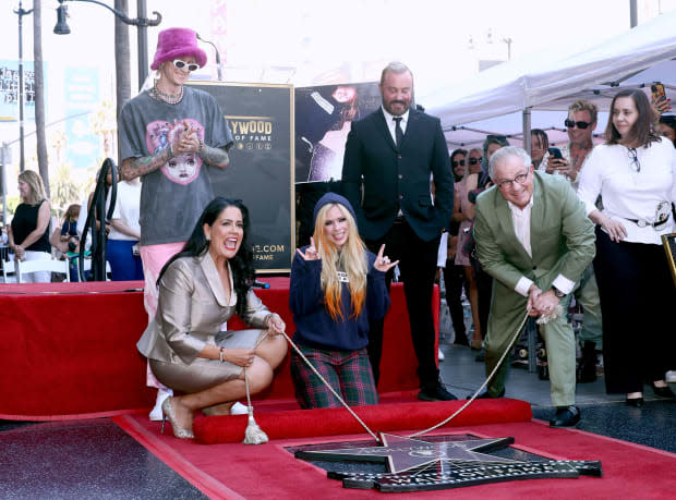 <p>LOS ANGELES, CALIFORNIA - AUGUST 31: (L-R) Machine Gun Kelly, Lupita Sanchez Cornejo, Avril Lavigne, John Feldmann and David Michael Jerome attend the Hollywood Walk of Fame Star Ceremony celebrating Avril Lavigne on August 31, 2022 in Los Angeles, California. (Photo by Emma McIntyre/Getty Images)</p>