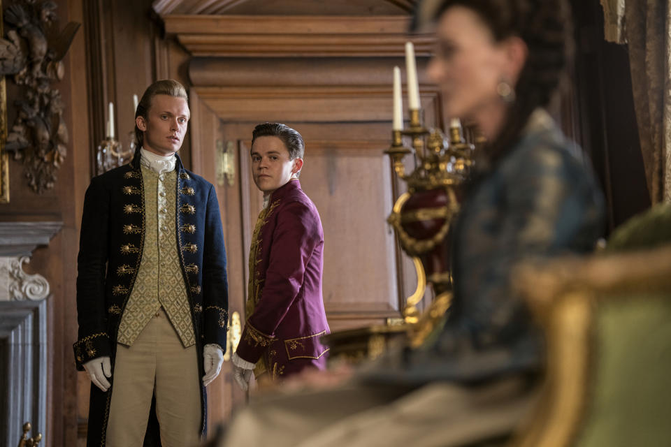 (L to R) Freddie Dennis as Reynolds, Sam Clemmett as Young Brimsley, Michelle Fairley as Princess Augusta in episode 106 of Queen Charlotte: A Bridgerton Story. (Nick Wall/Netflix)