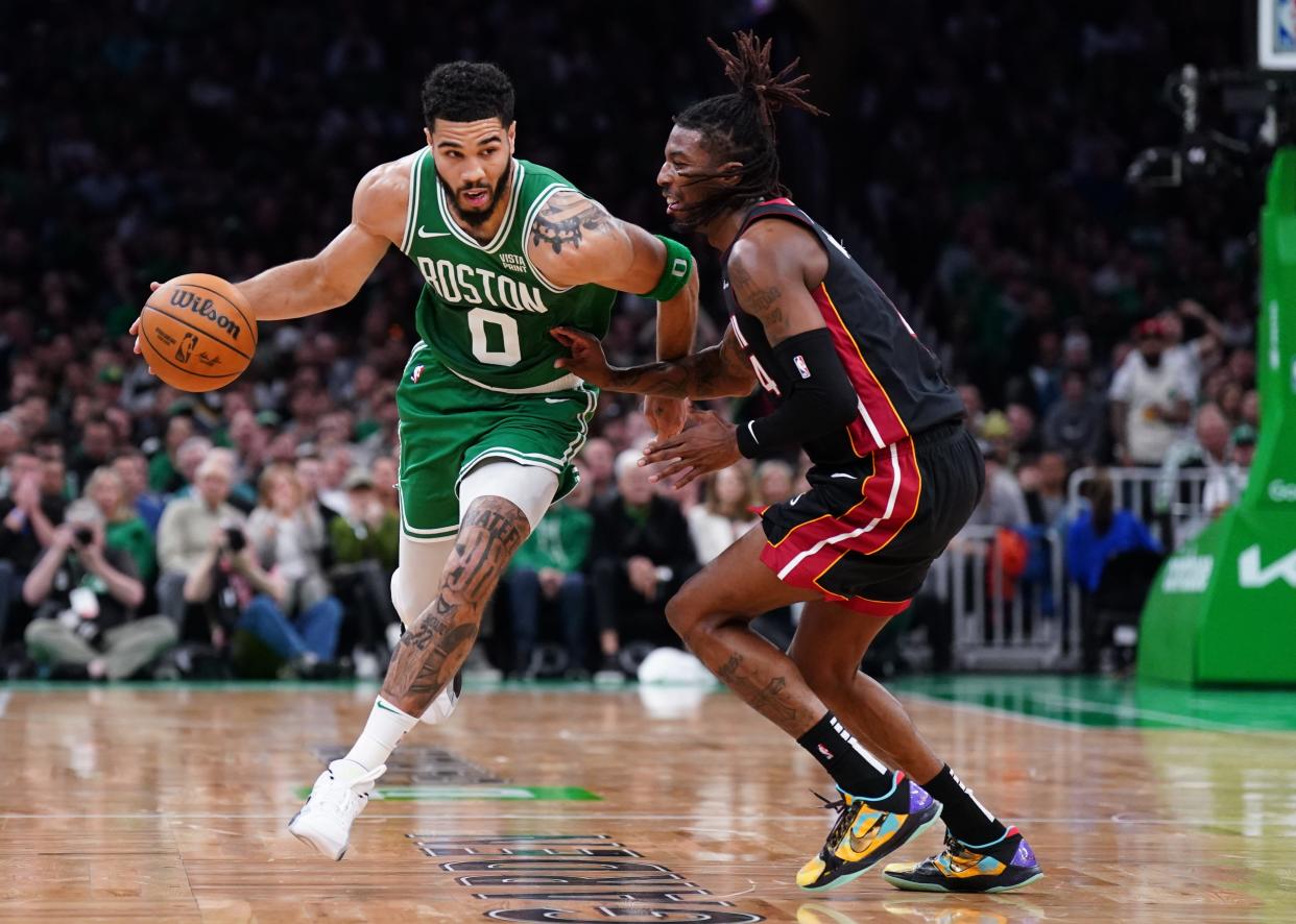 Apr 24, 2024; Boston, Massachusetts, USA; Boston Celtics forward Jayson Tatum (0) drives the ball against Miami Heat guard Delon Wright (4) in the second quarter during game two of the first round for the 2024 NBA playoffs at TD Garden. Mandatory Credit: David Butler II-USA TODAY Sports