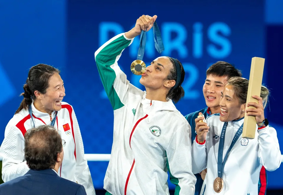 PARIS, FRANCE - AUGUST 09: Imane Khelif of Team Algeria celebrates as she wins gold medal after defeating Liu Yang (blue) of China in the Boxing Women's 66kg Final match on day fourteen of the Olympic Games Paris 2024 at Roland Garros on August 09, 2024 in Paris, France. (Photo by Aytac Unal/Anadolu via Getty Images)