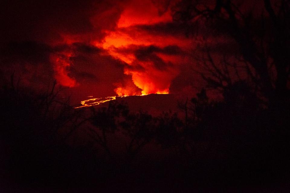 Rivers of molten rock could be seen high up on the volcano, venting huge clouds of steam and smoke at the summit on Big Island (AFP via Getty Images)