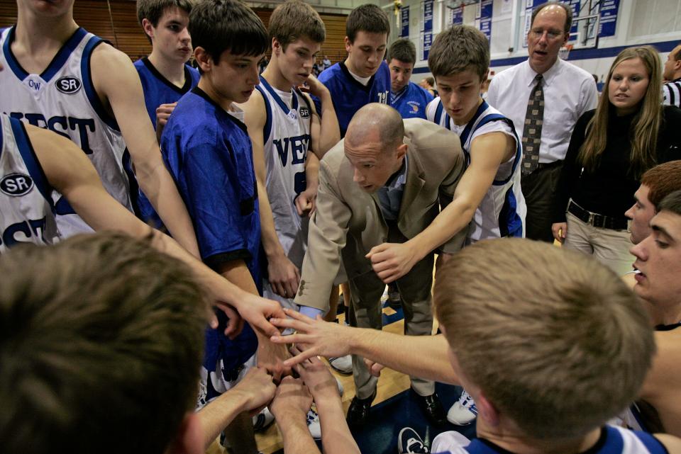 Coach Lance Randall encourages his Oshkosh West players before facing Appleton North in 2005. Randall led West to two WIAA state titles in 2006 and 2007. He was hired by Wisconsin as an assistant to coach Greg Gard.