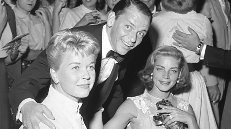 Sinatra posing with celebrities at The Sands