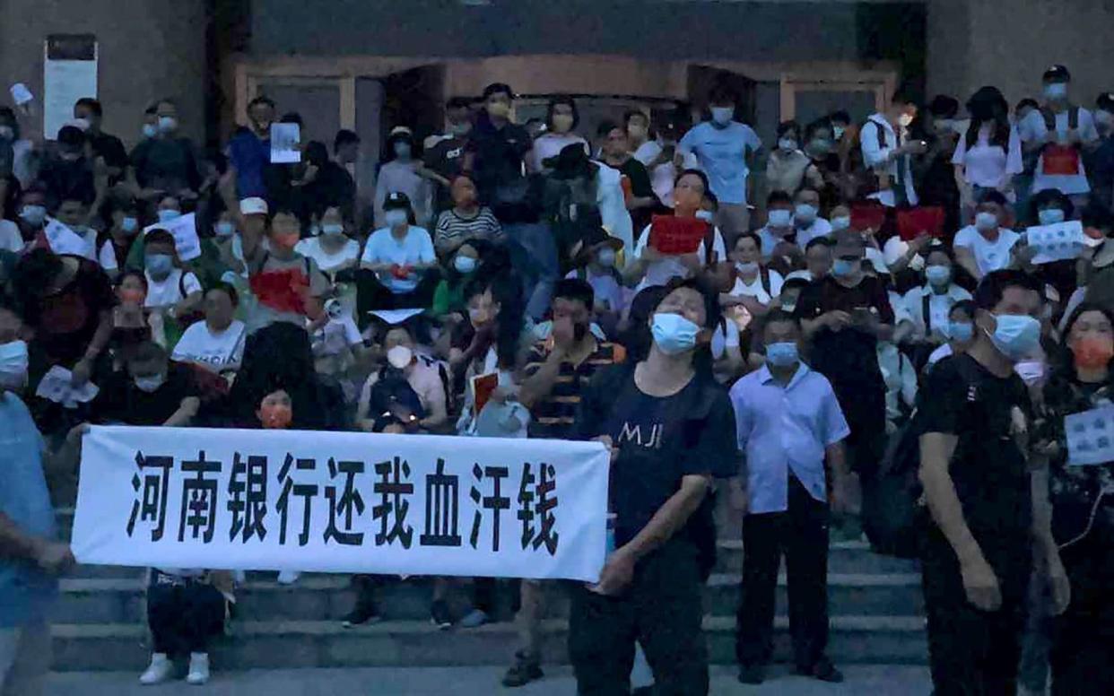China is accused of using its health tracking app to prevent protesters in Henan from mobilising - AP Photo