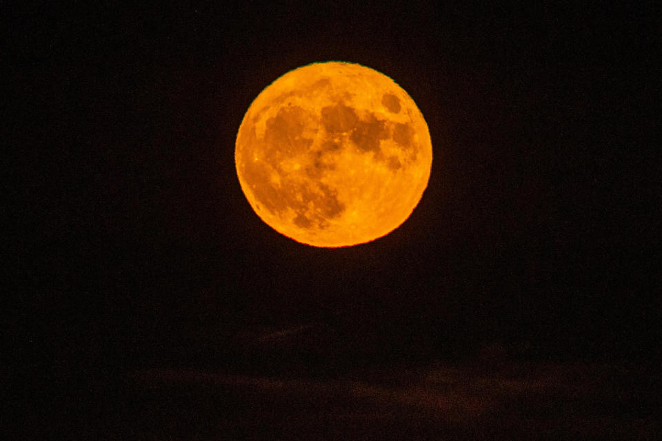 The full Sturgeon supermoon rises in the horizon seen from Alameda, Calif., on Thursday, August 11, 2022. / Credit: Ray Chavez/MediaNews Group/The Mercury News via Getty Images