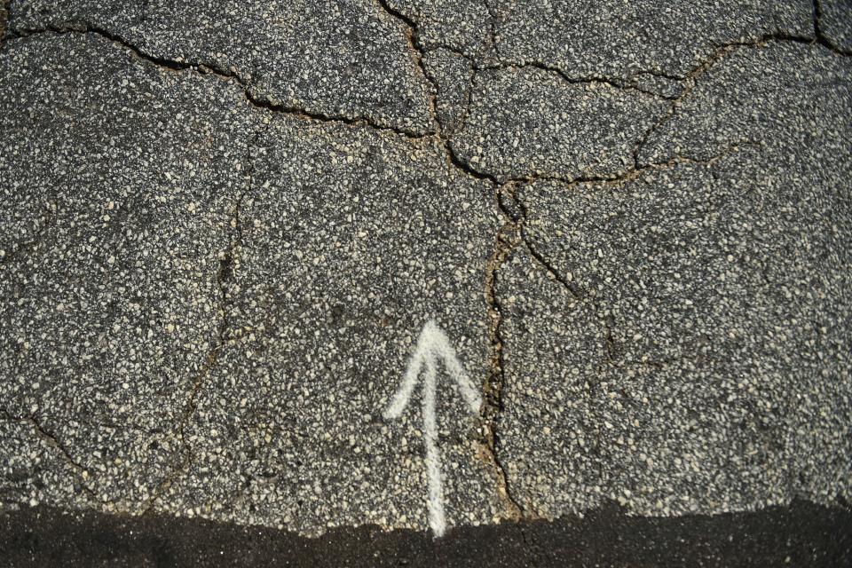 Cracks are seen in the pavement in the cul de sac on Hawkins Creek Court in Greenville, S.C., on Wednesday, Oct. 4. Hawkins Creek Court, beginning at Old Bucombe Road, is on Greenville County's most recent paving list.