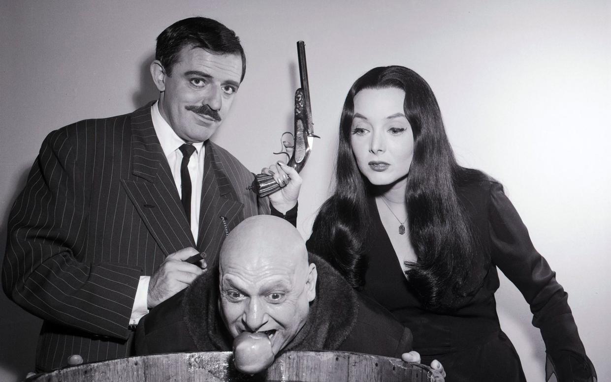 John Astin, Jackie Coogan and Carolyn Jones in The Addams Family - Getty