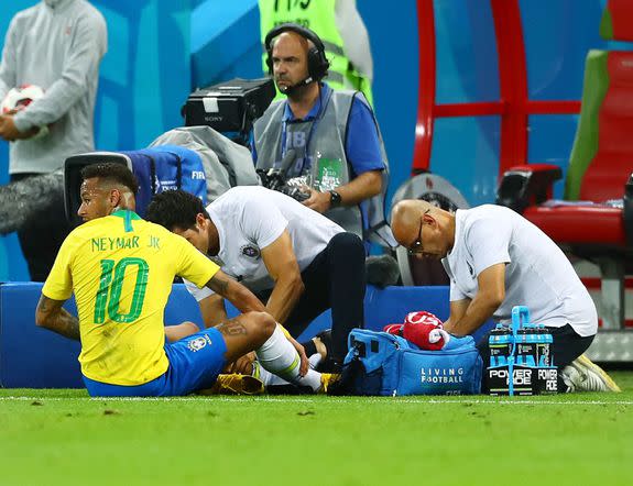Neymar lying on the pitch.