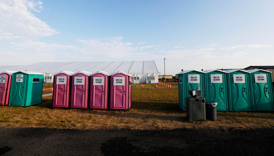 Portable restrooms are lined up along a soccer field at the U.S. government's newest holding center for migrant children in Carrizo Springs, Texas. (Photo: Eric Gay/Pool via Reuters)