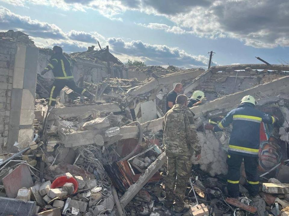 Rescues work at a site of a Russian military strike, amid Russia's attack on Ukraine, in the village of Hroza, in Kharkiv region, Ukraine October 5, 2023.