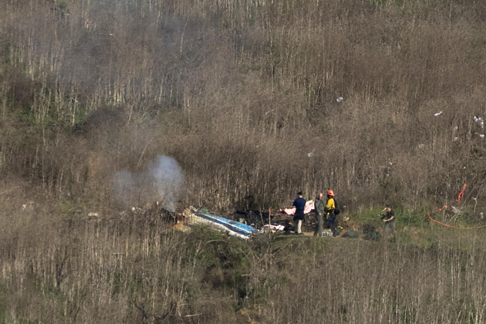 CALABASAS, CA - JANUARY 26: Investigators work at the scene of a helicopter crash that killed former NBA star Kobe Bryant on January 26, 2020 in Calabasas, California. Nine people have been confirmed dead in the crash, among them Bryant and his 13-year-old daughter Gianna. (Photo by David McNew/Getty Images)