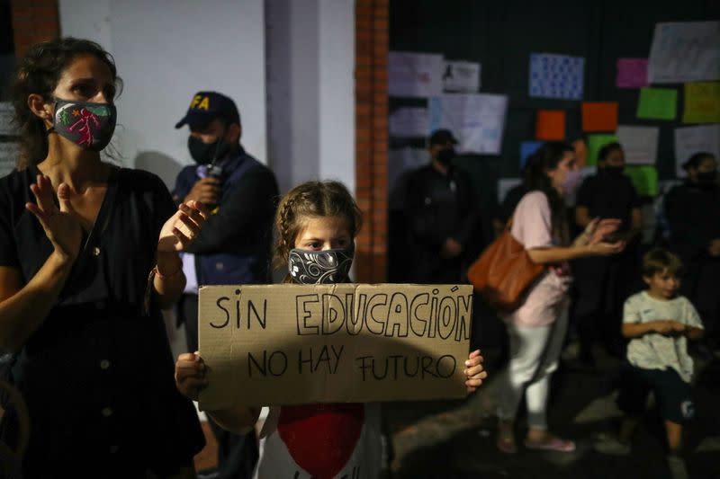 Demonstrators protest against new restrictions amid a rise in coronavirus disease (COVID-19) cases in Buenos Aires