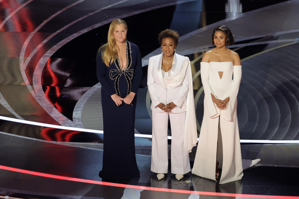 HOLLYWOOD, CALIFORNIA - MARCH 27: (L-R) Co-hosts Amy Schumer, Wanda Sykes, and Regina Hall speak onstage during the 94th Annual Academy Awards at Dolby Theatre on March 27, 2022 in Hollywood, California. (Photo by Neilson Barnard/Getty Images)