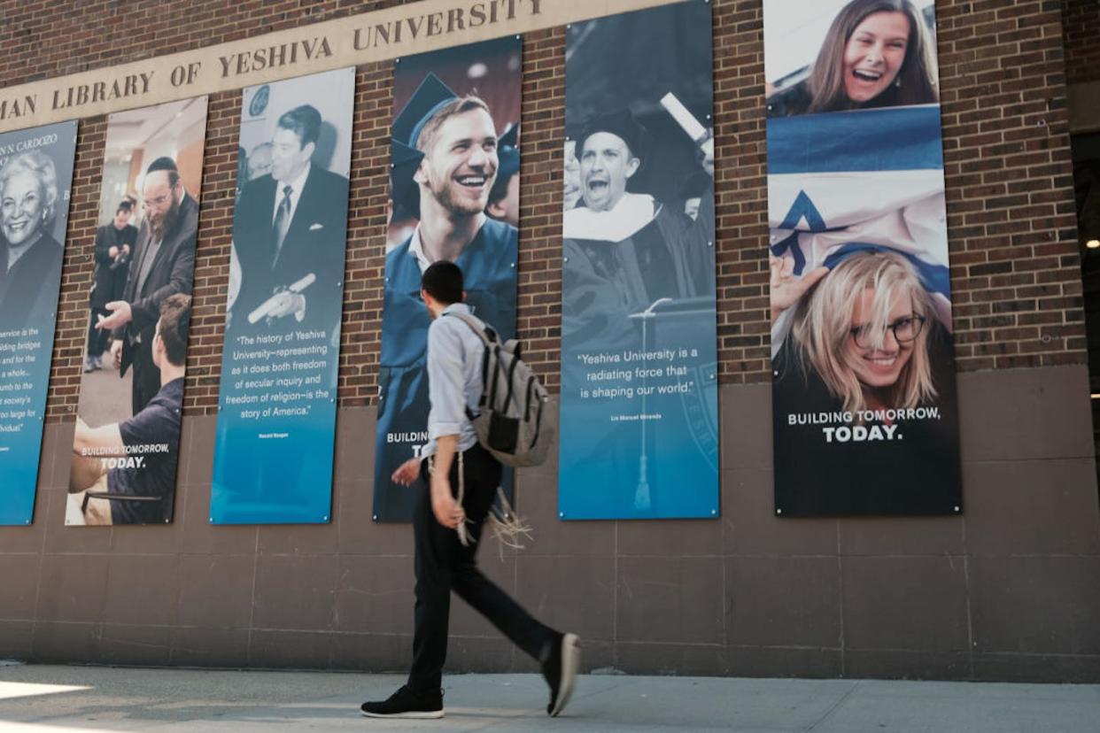 People walk by the campus of Yeshiva University in New York City. <a href="https://www.gettyimages.com/detail/news-photo/people-walk-by-the-campus-of-yeshiva-university-in-new-york-news-photo/1419391874?phrase=yeshiva&adppopup=true" rel="nofollow noopener" target="_blank" data-ylk="slk:Spencer Platt/Getty Images;elm:context_link;itc:0;sec:content-canvas" class="link ">Spencer Platt/Getty Images</a>