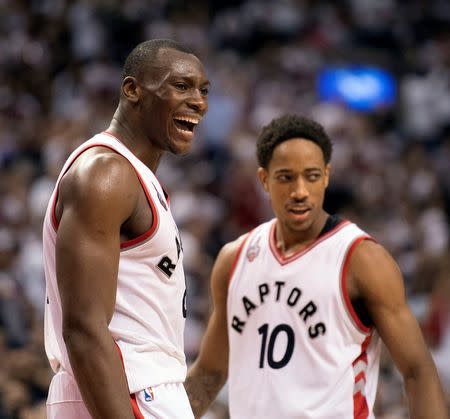 May 15, 2016; Toronto, Ontario, CAN; Toronto Raptors center Bismack Biyombo (8) celebrates after scoring a basket during the third quarter in game seven of the second round of the NBA Playoffs against the Miami Heat at Air Canada Centre. The Toronto Raptors won 116-89. Mandatory Credit: Nick Turchiaro-USA TODAY Sports