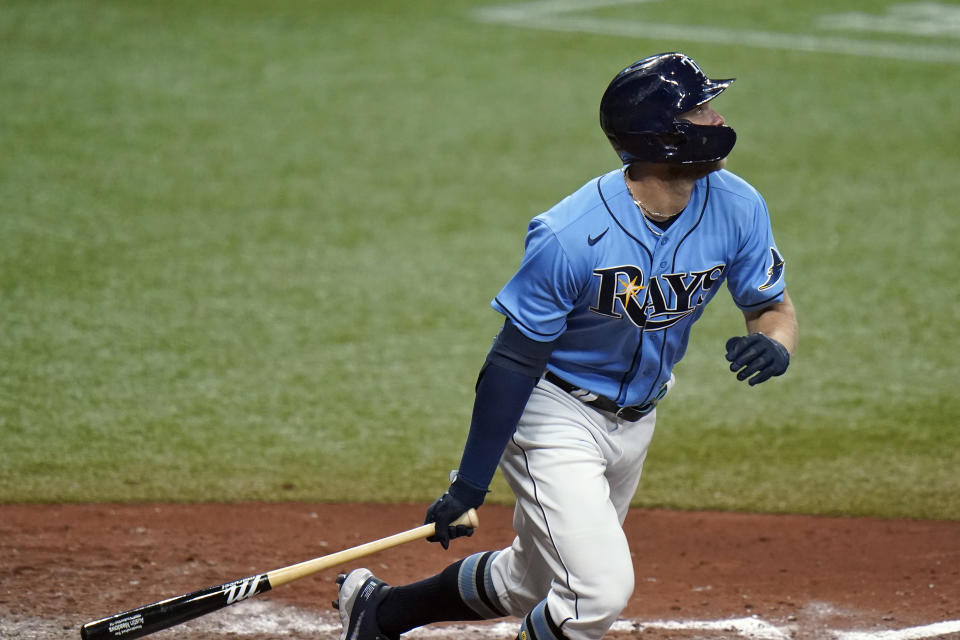 Tampa Bay Rays' Austin Meadows watches his double off New York Yankees starting pitcher Jameson Taillon during the fifth inning of a baseball game Thursday, May 13, 2021, in St. Petersburg, Fla. (AP Photo/Chris O'Meara)