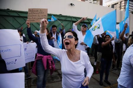 Demonstrators protest in support of Guatemalan President Jimmy Morales and his decision to expel Ivan Velasquez, head of the International Commission Against Impunity in Guatemala (CICIG), outside the CICIG headquarters in Guatemala City, Guatemala, August 27, 2017. REUTERS/Luis Echeverria