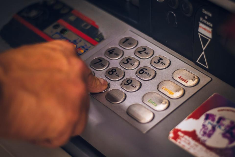 Withdrawing money from a Bank Automated Teller Machine (ATM)