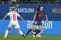 Barcelona's Ingrid Syrstad Engen, right, in action against Brann's Amalie Eikeland during the women's Champions League quarterfinals, second leg, soccer match between FC Barcelona and SK Brann Kvinner at the Estadi Johan Cruyff in Barcelona, Spain, Thursday, March 28, 2024. (AP Photo/Joan Monfort)