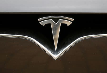 FILE PHOTO: The Tesla logo is pictured on a car during the electric car E-Rallye Baltica 2019