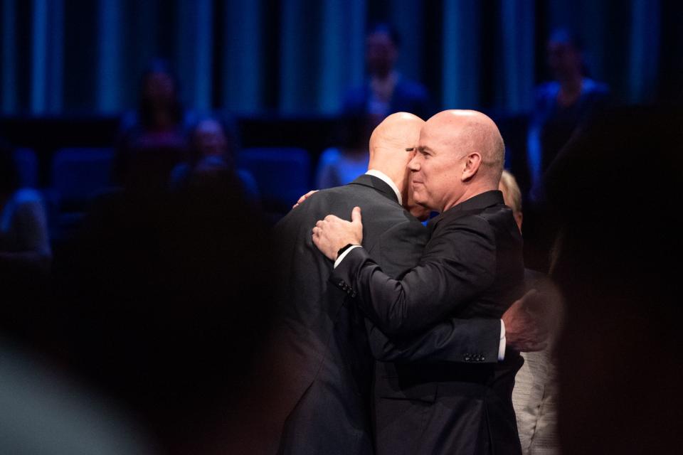 Elder Alvin F. Meredith III of the Seventy (the new president of BYU–Idaho as of Aug. 1, 2023) embraces outgoing President Henry J. Eyring in the BYU–Idaho Center in Rexburg, Idaho, on Tuesday, May 16, 2023. | The Church of Jesus Christ of Latter-day Saints