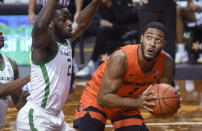 Oregon State guard Jarod Lucas (2) looks to shoot over Oregon forward Eugene Omoruyi during the first half of an NCAA college basketball game Saturday, Jan. 23, 2021, in Eugene, Ore. (AP Photo/Andy Nelson)