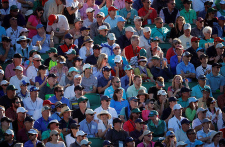 FILE PHOTO : The crowd watches play on the 15th hole, with none of the patrons using a cellular phone because they are not allowed, in third round play during the 2017 Masters golf tournament at Augusta National Golf Club in Augusta, Georgia, U.S., April 8, 2017. REUTERS/Lucy Nicholson/File Photo