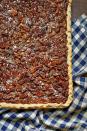 <p>You don't have to wait until Thanksgiving Day to break out the pecan desserts, you know! This larger-than-life pecan slab pie would be welcome at tailgates and fall dinner parties, too.</p><p><strong><a href="https://www.countryliving.com/food-drinks/a29145983/nancy-fuller-pecan-slab-pie/" rel="nofollow noopener" target="_blank" data-ylk="slk:Get the recipe;elm:context_link;itc:0;sec:content-canvas" class="link ">Get the recipe</a>.</strong></p><p><a class="link " href="https://www.amazon.com/Best-Sellers-Kitchen-Dining-Baking-Cookie-Sheets/zgbs/kitchen/289674?tag=syn-yahoo-20&ascsubtag=%5Bartid%7C10050.g.454%5Bsrc%7Cyahoo-us" rel="nofollow noopener" target="_blank" data-ylk="slk:SHOP BAKING SHEETS;elm:context_link;itc:0;sec:content-canvas">SHOP BAKING SHEETS</a></p>