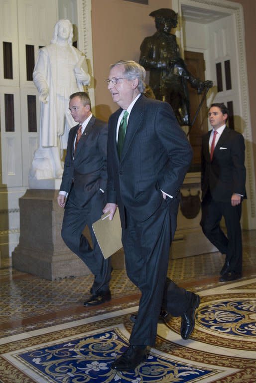 US Senate Minority Leader Mitch McConnell walks towards the Senate floor to deliver remarks on the fiscal cliff on December 31, 2012, on Capitol Hill in Washington, DC