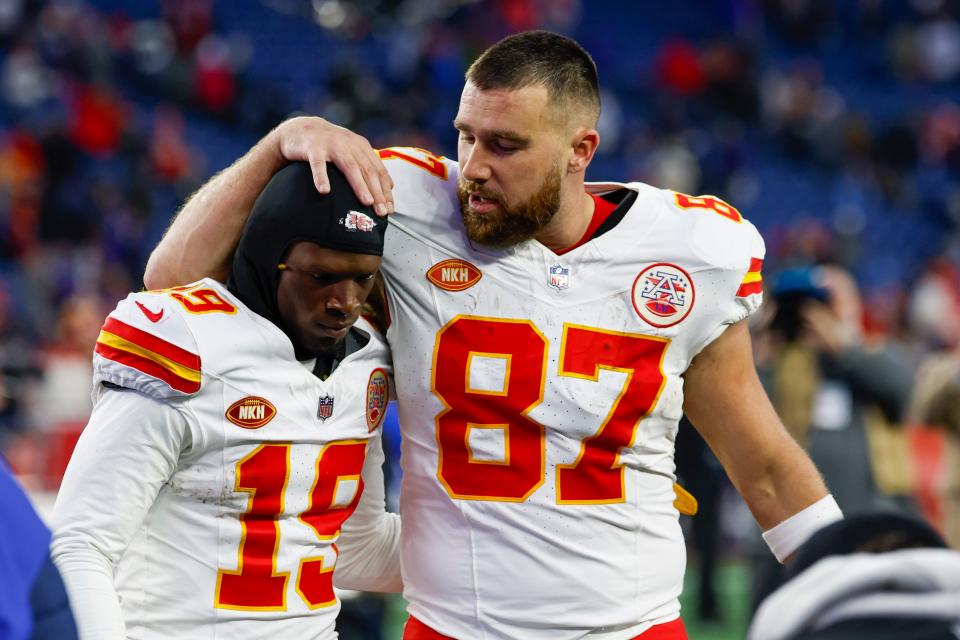 Kansas City Chiefs tight end Travis Kelce (87) celebrates with wide receiver Kadarius Toney (19) at the conclusion of an NFL football game against the New England Patriots on Sunday, Dec. 17, 2023, in Foxborough, Mass.