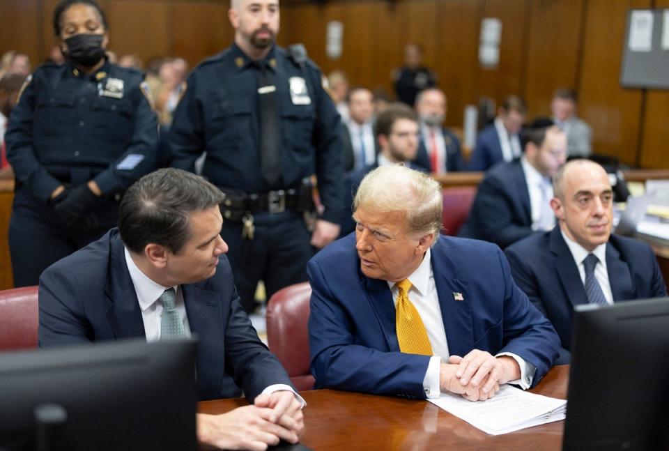 Donald Trump, with lawyers Todd Blanche (left) and Emil Bove (POOL/AFP via Getty Images)