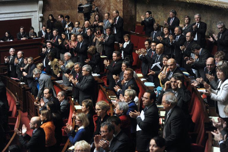 Some left-wing members of Parliament applaud after French lawmakers voted in favour of recognising Palestine as a state on December 2, 2014, at the French National Assembly in Paris