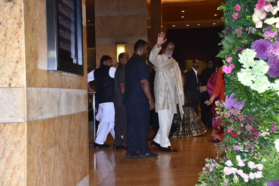 Amitabh Bachchan waves at the paparazzi. 