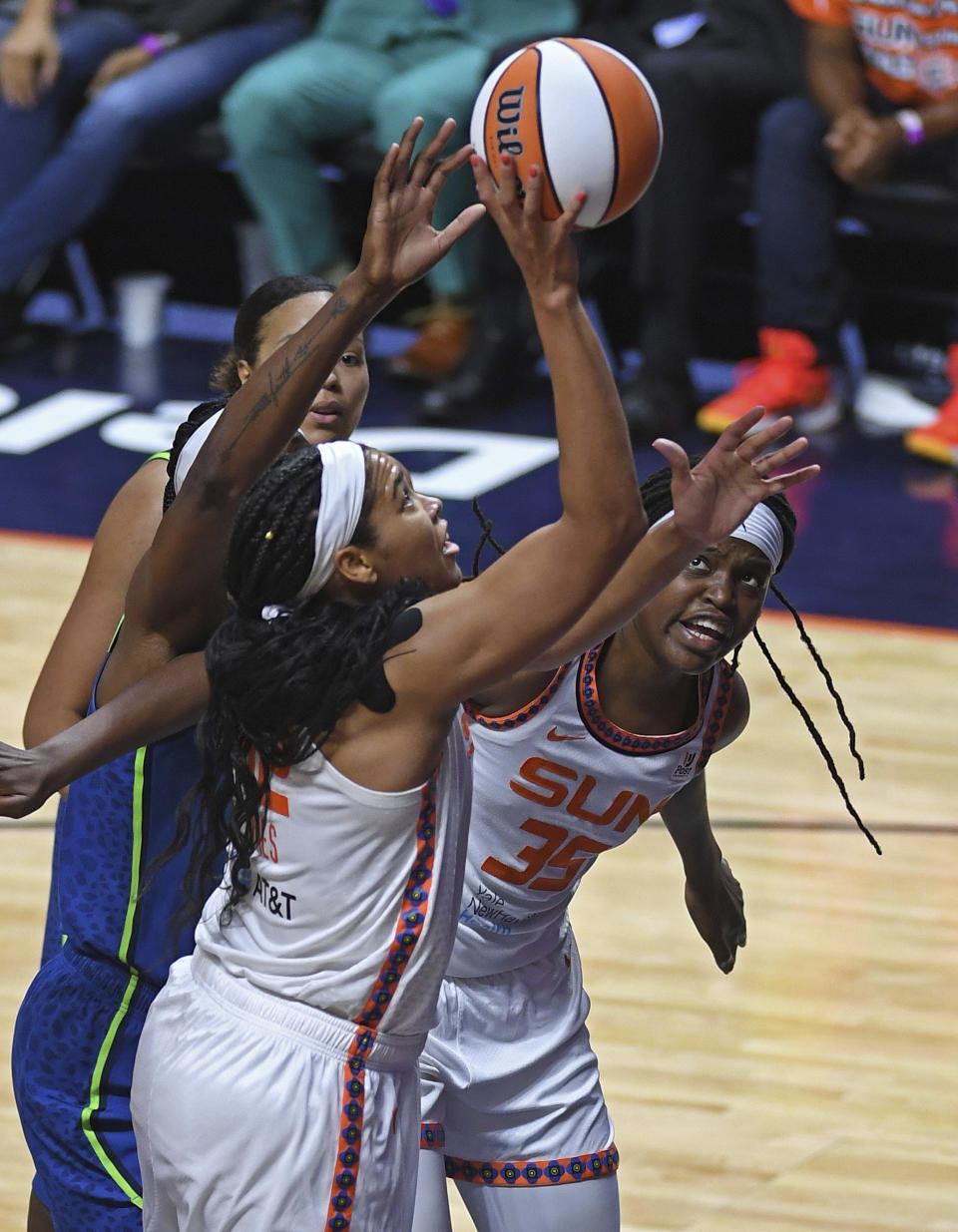 Connecticut Sun center Brionna Jones, center, scores over Minnesota Lynx center Sylvia Fowles, left, during a WNBA basketball game Sunday, Aug. 14, 2022, in Uncasville, Conn. (Sean D. Elliot/The Day via AP)