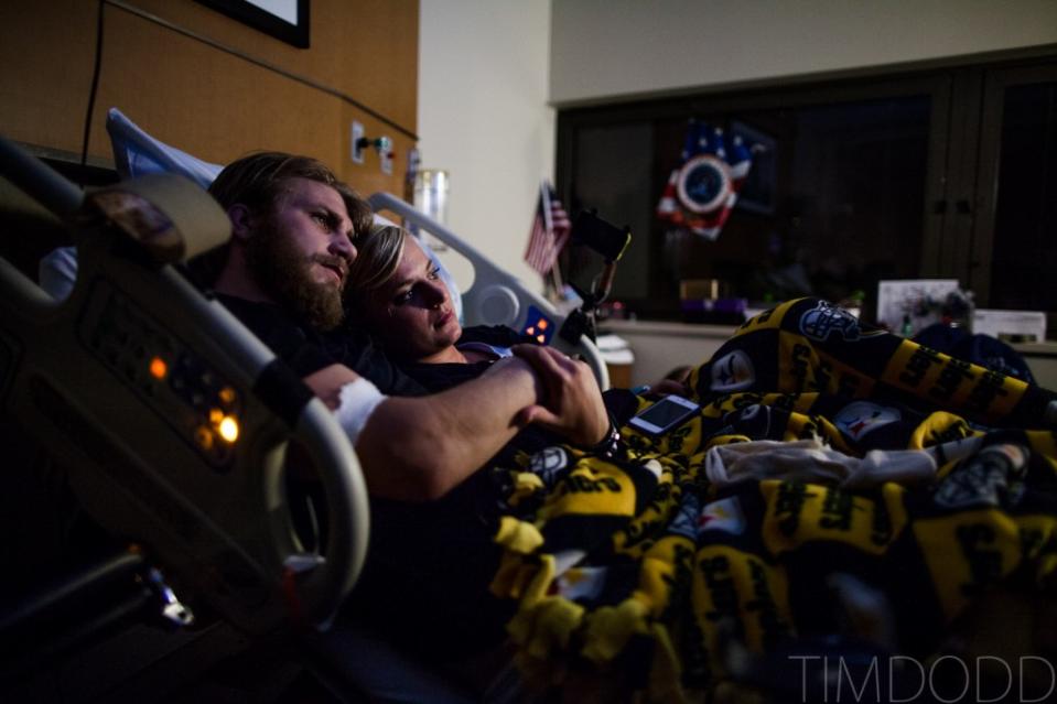 Taylor Morris and Danielle Kelly still cuddle watching a movie at Walter Reed Medical Academy in Washington