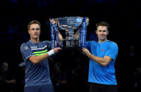 Tennis - ATP World Tour Finals - The O2 Arena, London, Britain - November 19, 2017 Finland's Henri Kontinen and Australia's John Peers celebrate winning the doubles final against Poland's Lukasz Kubot and Brazil's Marcelo Melo with the trophy Action Images via Reuters/Tony O'Brien