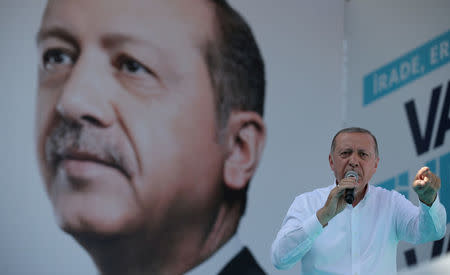 FILE PHOTO: Turkish President Tayyip Erdogan addresses his supporters during an election rally in Ankara, Turkey, June 9, 2018. REUTERS/Umit Bektas/File Photo