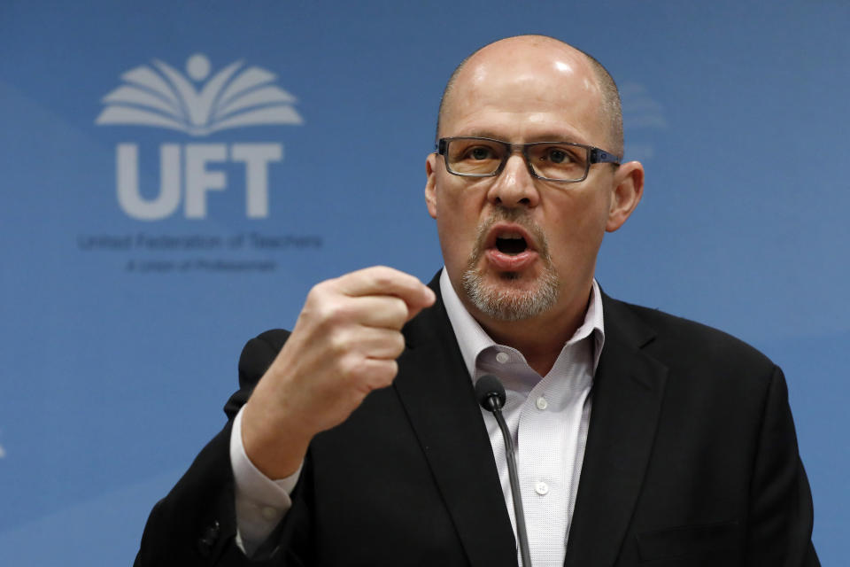 FILE- In this March 15, 2020 file photo, Michael Mulgrew, president of the United Federation of Teachers in New York City, addresses a news conference at UFT headquarters in New York. As New York City's school year takes the first steps toward opening on Wednesday, Sept. 16, 2020, Mulgrew has questioned both staffing levels and coronavirus safety. (AP Photo/Richard Drew, File)