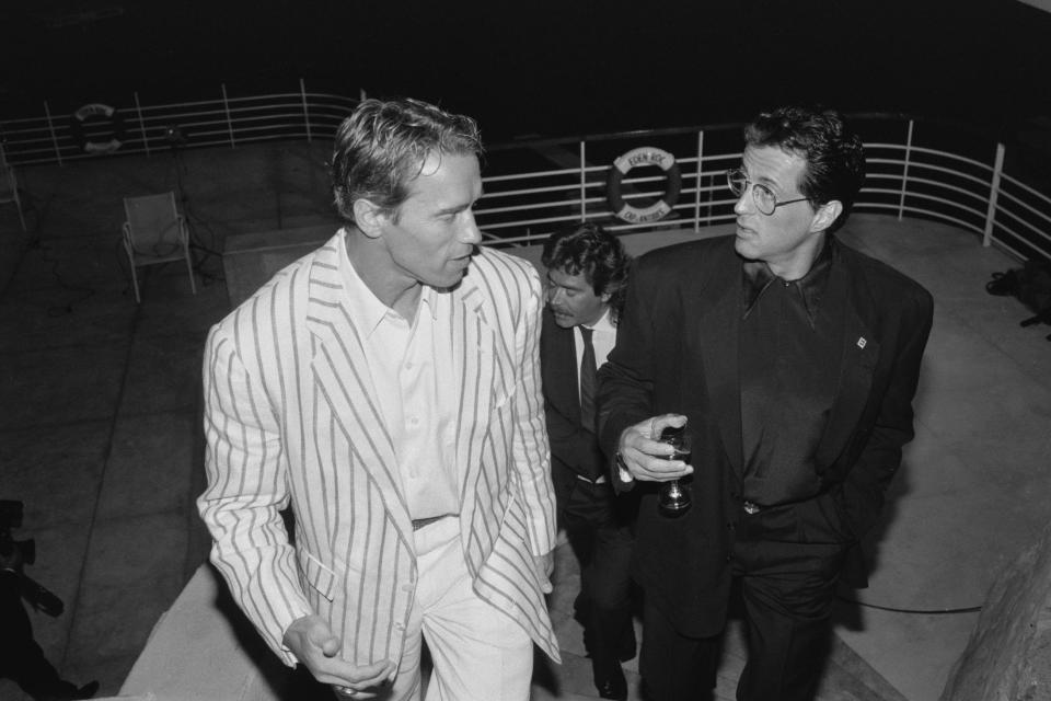 Arnold Schwarzenegger and Sylvester Stallone at an event in Cannes, France, May 1990.