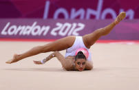 LONDON, ENGLAND - AUGUST 09: Evgeniya Kanaeva of Russia performs with the ball during the Rhythmic Gymnastics qualification on Day 13 of the London 2012 Olympics Games at Wembley Arena on August 9, 2012 in London, England. (Photo by Julian Finney/Getty Images)