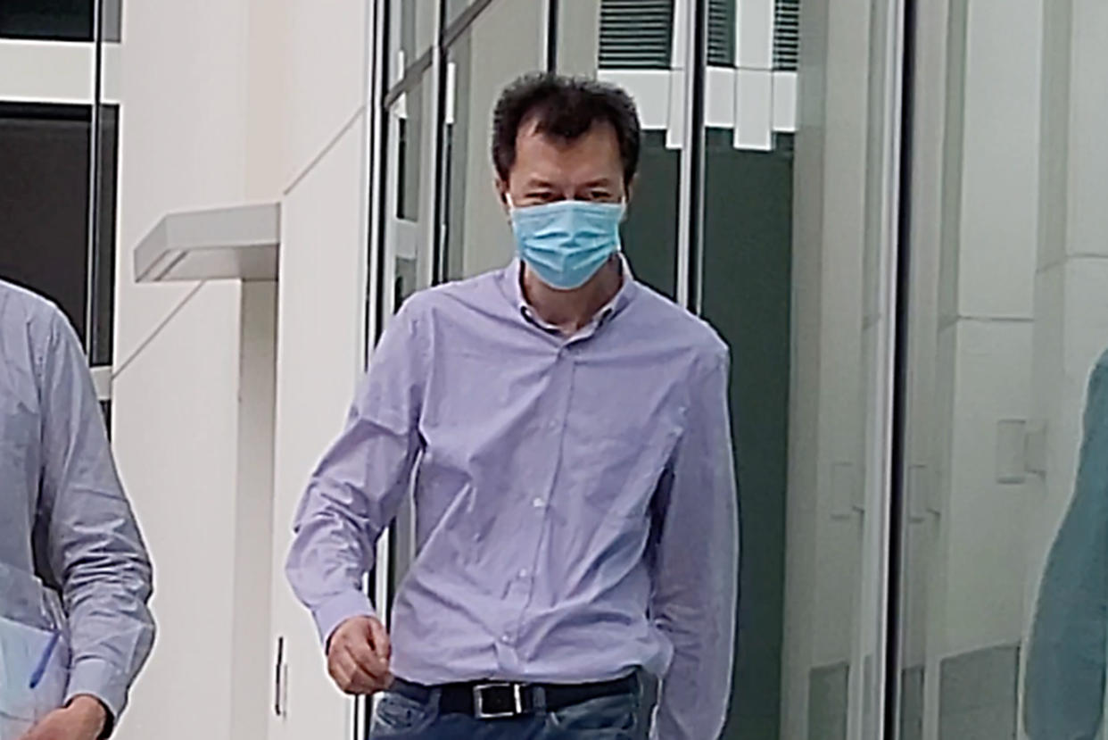 Bai Fan exiting the State Courts on Thursday (27 March). (PHOTO: Yahoo News Singapore/Wan Ting Koh)