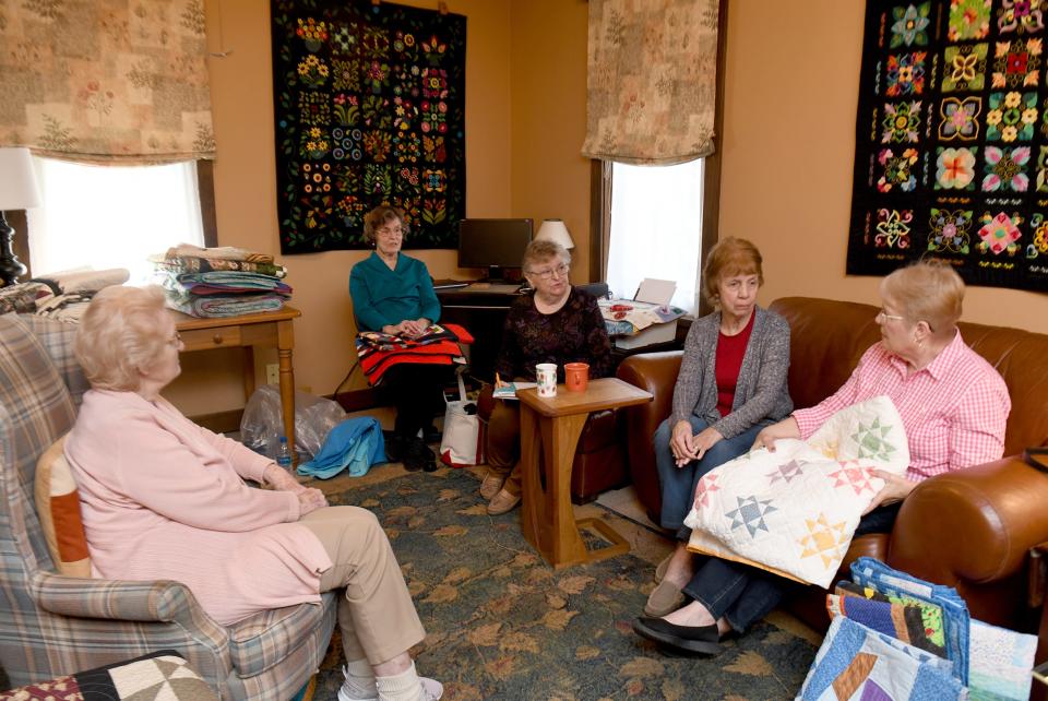 Members talk about their organization as Canton Quilters Guild celebrates its 25th anniversary.  Thursday, April 28, 2022.