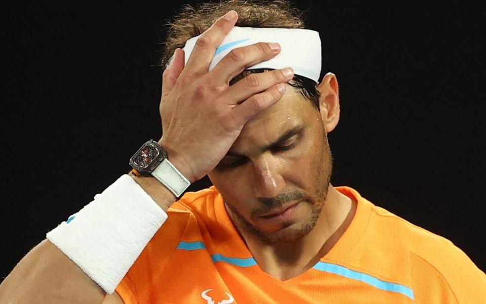 Rafael Nadal looks dejected after crashing out of the Australian Open against Mackenzie McDonald - Rafael Nadal fears grow after Monte Carlo Masters withdrawal - Reuters/Carl Recine
