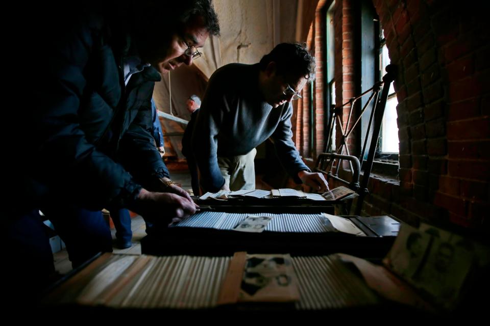 Robert Rocha Jr., Associate Curator of Science and Research at New Bedford Whaling Museum and D. Jordan Berson, Director of Collections, take a closer look at Ash Street jail records dating to between 1910 and 1940 which are stored in the jail's attic space and which the Whaling Museum are considering adding to their collections.  The Ash Street jail in New Bedford is the oldest operational jail in the country and is being consideredd to be closed.