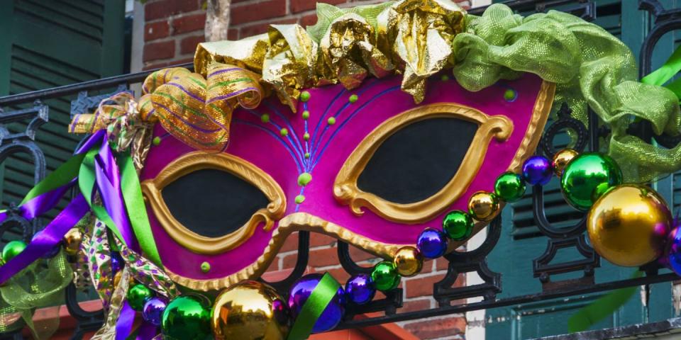 mardi gras mask on fence