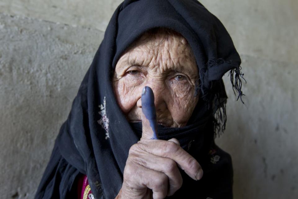 <div class="inline-image__caption"><p>An elderly Afghan woman shows off her inked finger to the camera after she made it to the polls to cast her vote September 18, 2010 in Kabul, Panjshir, Afghanistan. More than 2,500 candidates will contest for 249 seats in the lower house of the Afghan parliament in the country's second election.The Taliban warned voters to boycott the polls threatening violence to disturb the election process. </p></div> <div class="inline-image__credit">Paula Bronstein/Getty</div>